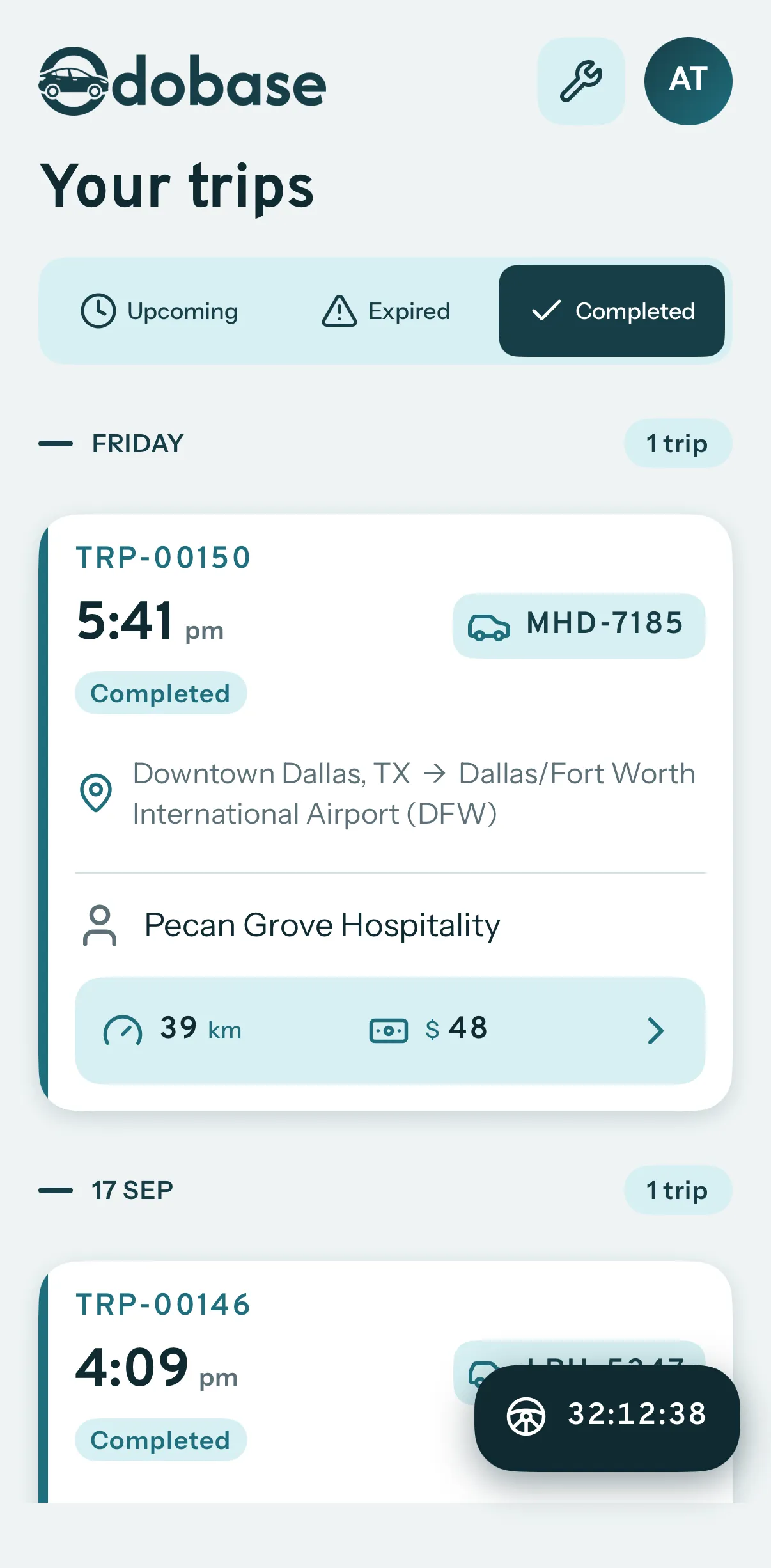 The driver's completed trips: a run from downtown Dallas to DFW airport with the customer, the distance driven and the expenses logged.