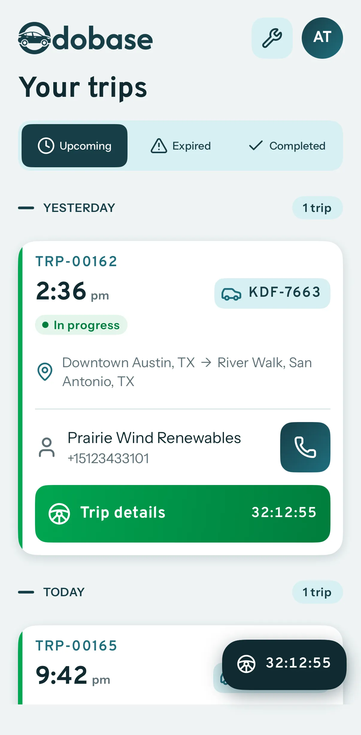 The driver's trip list in the Odobase Driver app: a trip from Austin to San Antonio in progress with its vehicle, customer and running time, and today's next trip below it.